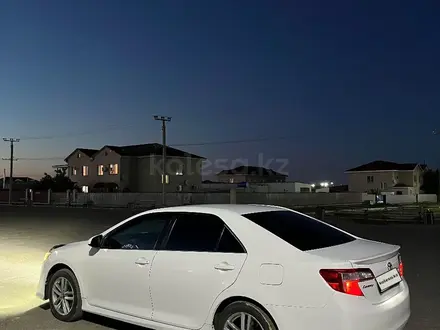 Toyota Camry 2014 года за 6 900 000 тг. в Атырау