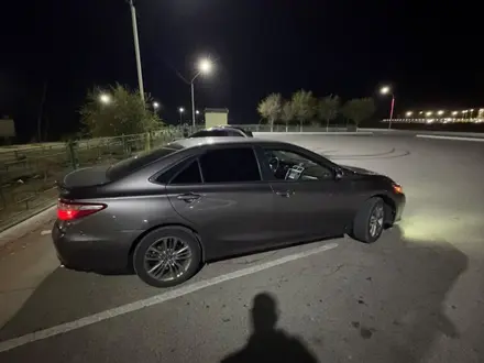 Toyota Camry 2015 года за 5 400 000 тг. в Жанаозен – фото 14