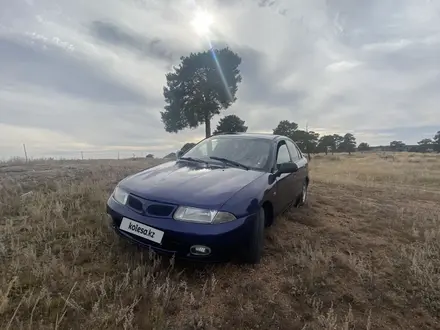 Mitsubishi Carisma 1998 года за 1 500 000 тг. в Астана – фото 2