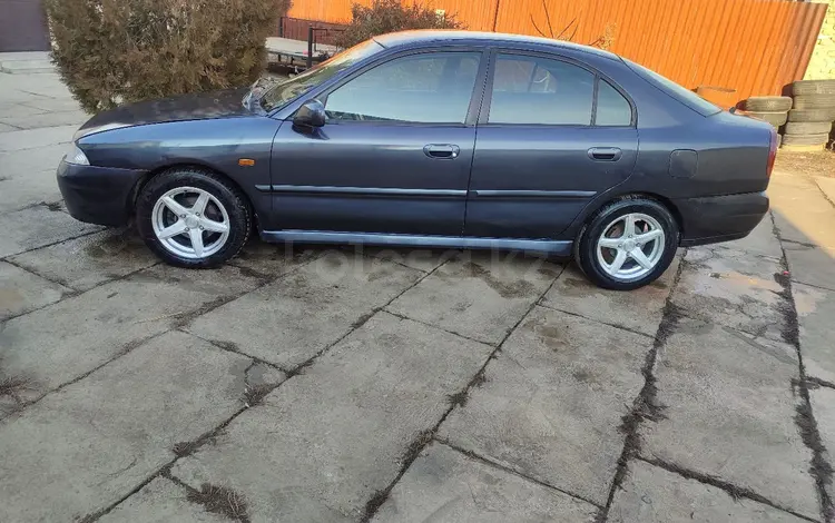 Mitsubishi Carisma 1998 годаүшін1 250 000 тг. в Тараз