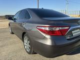 Toyota Camry 2015 года за 7 600 000 тг. в Жанаозен – фото 2