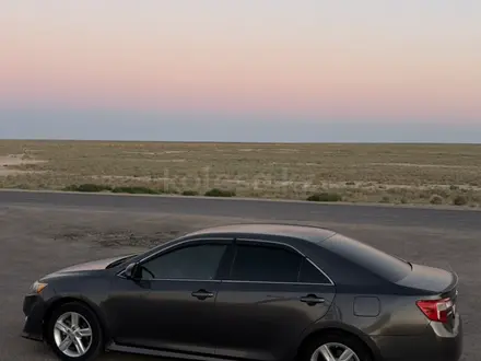 Toyota Camry 2014 года за 7 350 000 тг. в Жанаозен