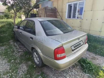 Mazda 323 1999 года за 1 400 000 тг. в Алматы – фото 2