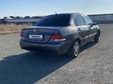 Mitsubishi Lancer 2006 годаүшін950 000 тг. в Атырау – фото 2