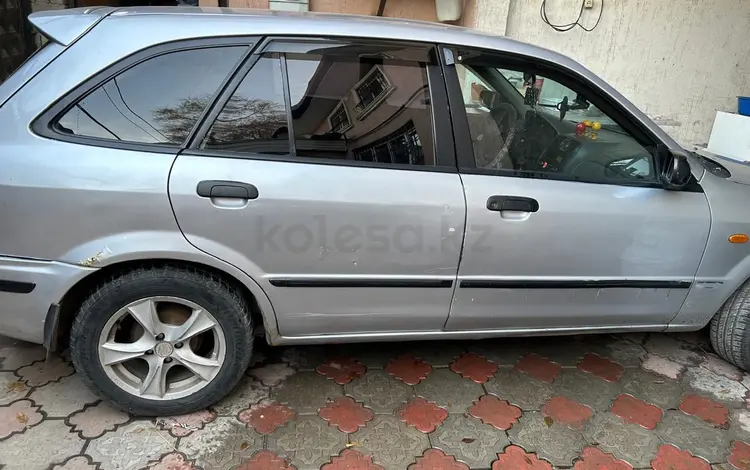 Mazda 323 1999 годаүшін2 200 000 тг. в Алматы