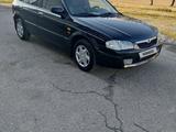 Mazda 323 2000 года за 2 000 000 тг. в Алматы – фото 2