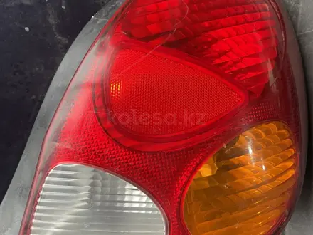 Задний фанар Тайота Corolla за 100 тг. в Алматы