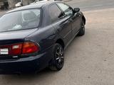 Mazda 323 1996 года за 550 000 тг. в Отеген-Батыр – фото 4