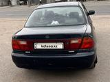 Mazda 323 1996 года за 550 000 тг. в Отеген-Батыр – фото 5