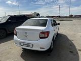 Renault Logan 2014 года за 2 800 000 тг. в Атырау – фото 3