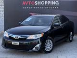 Toyota Camry 2014 годаfor8 700 000 тг. в Актобе