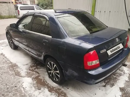Mazda 323 2000 года за 1 300 000 тг. в Алматы – фото 6