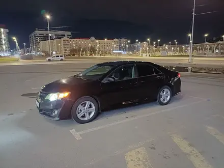 Toyota Camry 2013 года за 4 900 000 тг. в Атырау