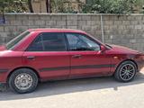Mazda 323 1994 года за 600 000 тг. в Шымкент – фото 2