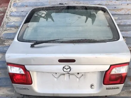 Крышка багажника Mazda 626 (птичка) за 50 000 тг. в Алматы