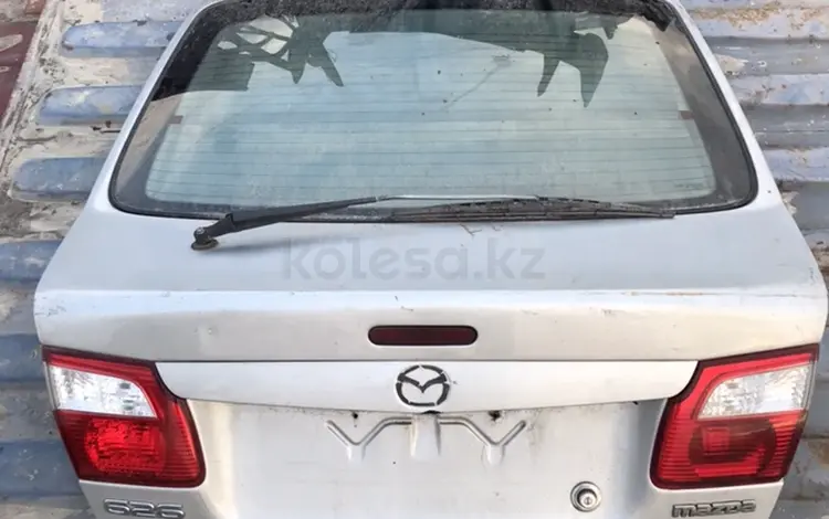 Крышка багажника Mazda 626 (птичка)үшін50 000 тг. в Алматы