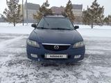 Mazda 323 2002 года за 2 500 000 тг. в Астана – фото 4