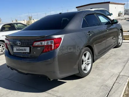 Toyota Camry 2014 года за 7 500 000 тг. в Жанаозен – фото 4