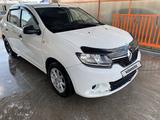 Renault Logan 2014 года за 2 700 000 тг. в Атырау – фото 2