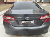 Toyota Camry 2014 года за 6 000 000 тг. в Актобе – фото 4