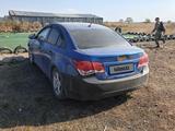 Chevrolet Cruze 2011 года за 1 600 000 тг. в Караганда – фото 2