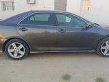 Toyota Camry 2013 года за 5 800 000 тг. в Жанаозен – фото 2