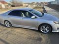 Toyota Camry 2014 года за 8 500 000 тг. в Жанаозен