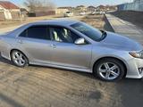 Toyota Camry 2014 года за 8 500 000 тг. в Жанаозен