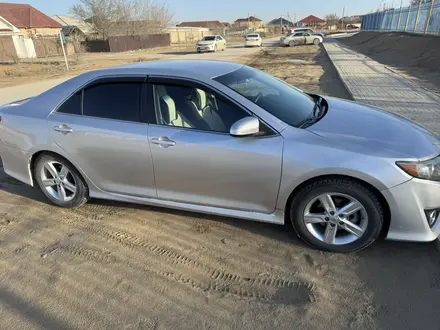 Toyota Camry 2014 года за 8 500 000 тг. в Жанаозен