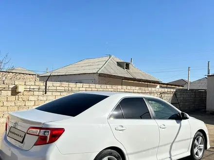 Toyota Camry 2014 года за 6 000 000 тг. в Жанаозен – фото 26