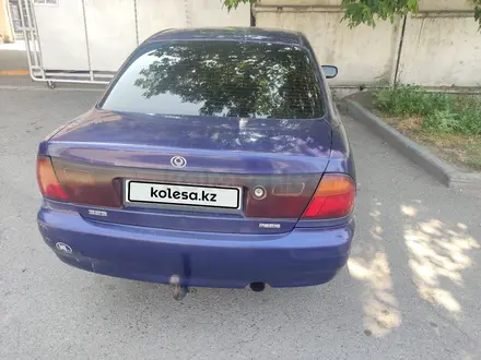 Mazda 323 1995 года за 850 000 тг. в Алматы – фото 7