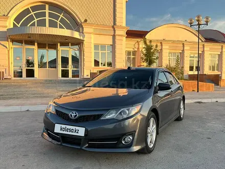 Toyota Camry 2013 года за 7 490 000 тг. в Жанаозен