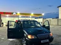 Kia Carnival 2001 годаfor1 800 000 тг. в Шымкент