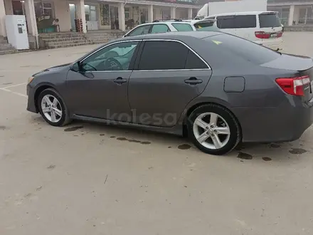 Toyota Camry 2013 года за 9 000 000 тг. в Жанаозен