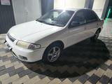 Mazda Familia 1997 годаүшін1 100 000 тг. в Мерке – фото 3