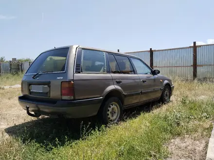 Mazda 323 1993 года за 550 000 тг. в Жетиген