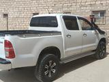 Toyota Hilux 2011 года за 6 800 000 тг. в Жанаозен – фото 2