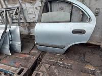 Дверь на Nissan Almera classic за 90 000 тг. в Алматы