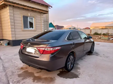 Toyota Camry 2017 года за 7 800 000 тг. в Атырау – фото 4