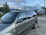 Kia Carnival 2005 года за 4 600 000 тг. в Актобе – фото 2