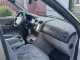 Kia Carnival 2005 года за 4 600 000 тг. в Актобе – фото 5