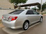 Toyota Camry 2013 года за 6 600 000 тг. в Жанаозен – фото 2