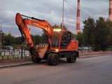Doosan  DX140W 2010 года за 24 000 000 тг. в Шымкент