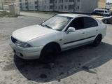 Mitsubishi Carisma 1997 годаүшін1 750 000 тг. в Тараз