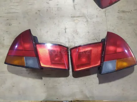 Задние фонари на Mitsubishi Carisma. Хэчбэк. за 1 200 тг. в Шымкент