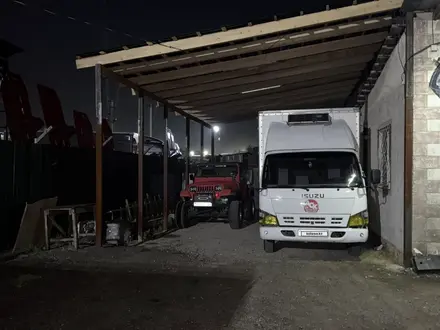 Isuzu  Elf (N-series) 2012 года за 12 500 000 тг. в Алматы – фото 4