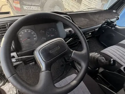 Isuzu  Elf (N-series) 2012 года за 12 500 000 тг. в Алматы – фото 13
