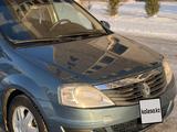 Renault Logan 2012 года за 2 650 000 тг. в Караганда – фото 4