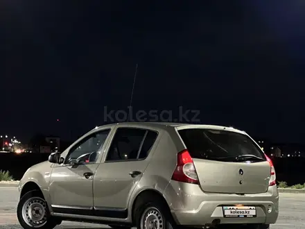 Renault Sandero 2013 года за 2 450 000 тг. в Атырау – фото 11