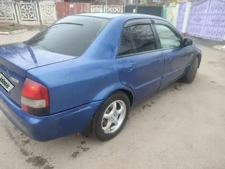 Mazda 323 2000 года за 1 800 000 тг. в Алматы – фото 13